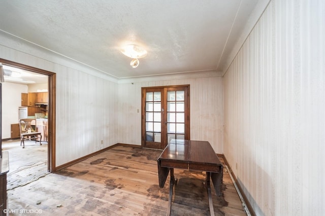7012 Sunrise Blvd, Windsor Heights, IA 50324 - home office featuring french doors and wood-type flooring