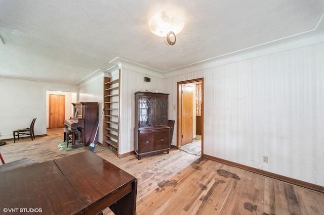 7012 Sunrise Blvd, Windsor Heights, IA 50324 - living room featuring crown molding, hardwood / wood-style floors, built in features, and a textured ceiling
