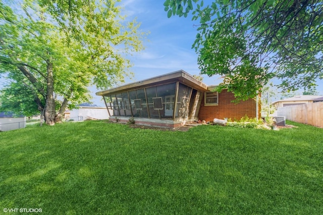 7012 Sunrise Blvd, Windsor Heights, IA 50324 - rear view of house with a sunroom and brick siding