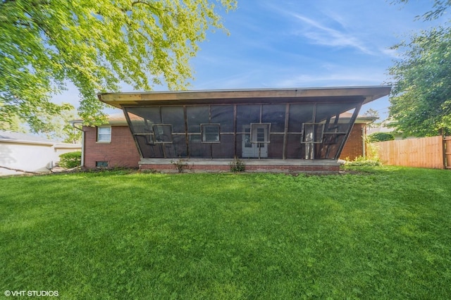 7012 Sunrise Blvd, Windsor Heights, IA 50324 - rear view of property featuring a sunroom and brick siding