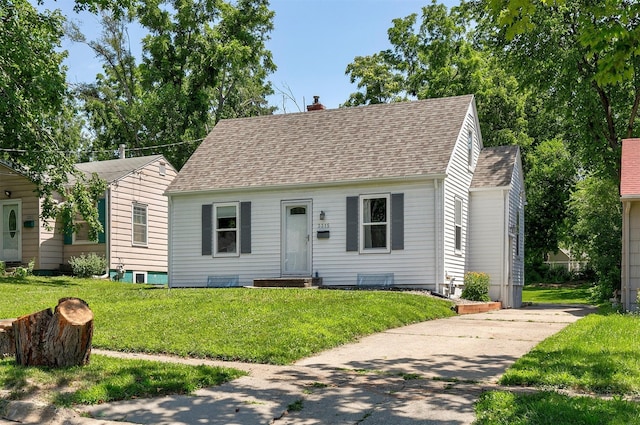 3315 61st St, Des Moines, IA 50322 - view of front of house with driveway, roof with shingles, a chimney, and a front yard