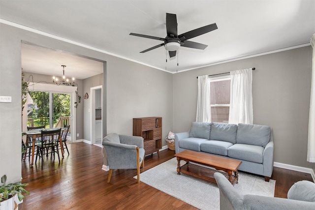 3315 61st St, Des Moines, IA 50322 - living room featuring a chandelier, wood finished floors, ceiling fan, and ornamental molding