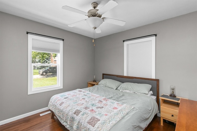 3315 61st St, Des Moines, IA 50322 - bedroom with dark wood-style flooring and ceiling fan