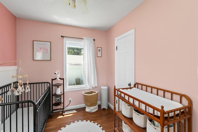 3315 61st St, Des Moines, IA 50322 - bedroom featuring wood finished floors and a ceiling fan