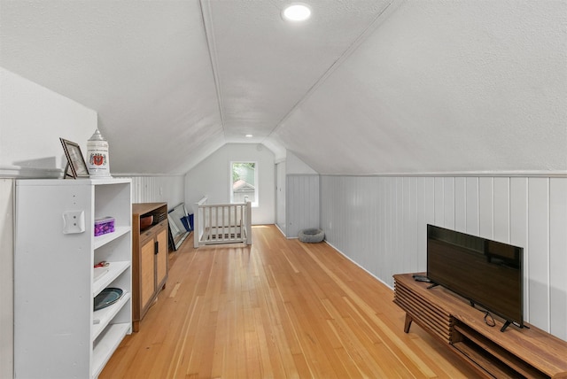 3315 61st St, Des Moines, IA 50322 - additional living space featuring light wood-style flooring and lofted ceiling