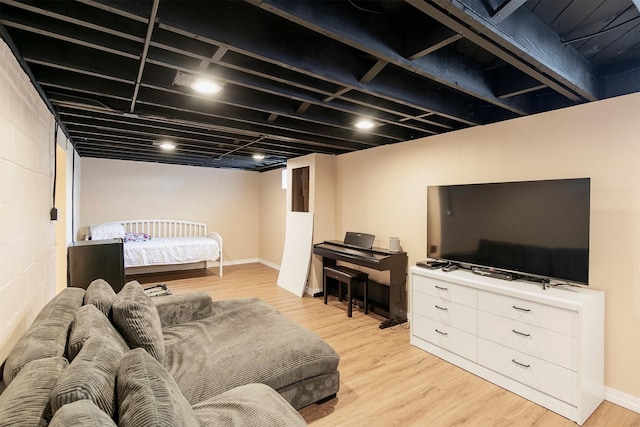 3315 61st St, Des Moines, IA 50322 - living area with light wood-style floors and concrete block wall