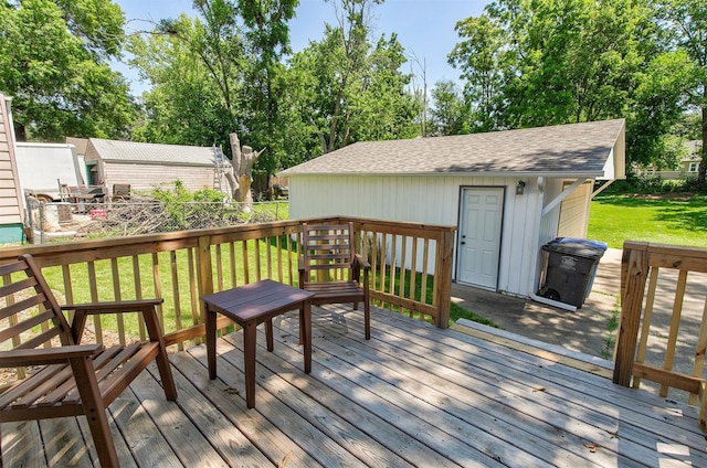 3315 61st St, Des Moines, IA 50322 - wooden deck with a lawn and an outdoor structure