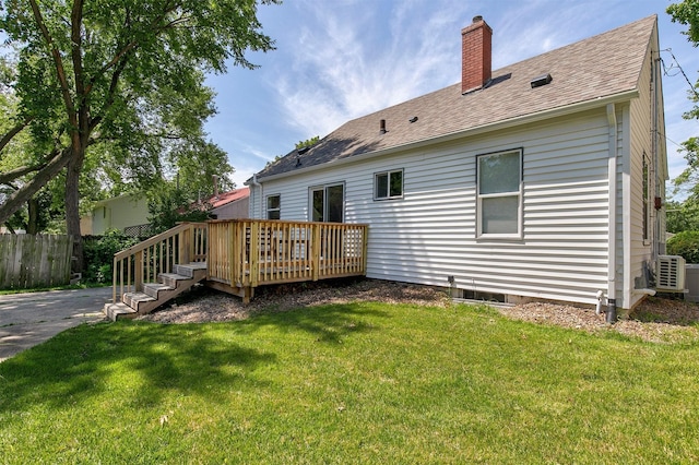 3315 61st St, Des Moines, IA 50322 - rear view of property with a chimney, a wooden deck, and roof with shingles