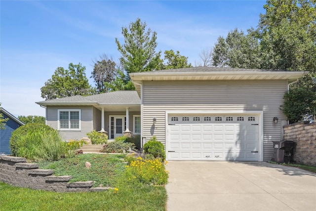 929 Sampson Dr, Nevada, IA 50201 - view of front of house with concrete driveway and an attached garage