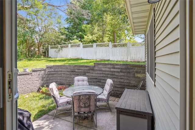929 Sampson Dr, Nevada, IA 50201 - fenced backyard featuring a patio area and outdoor dining space