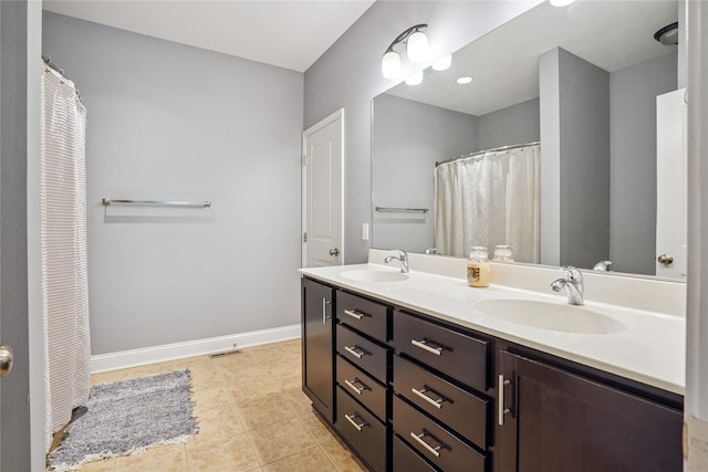 929 Sampson Dr, Nevada, IA 50201 - full bathroom with double vanity and tile patterned flooring