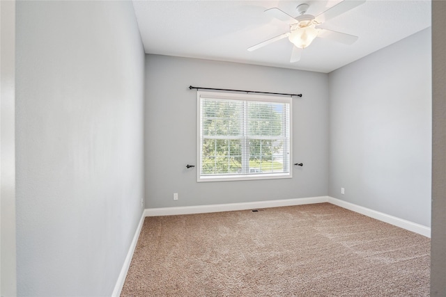 929 Sampson Dr, Nevada, IA 50201 - spare room featuring carpet and ceiling fan