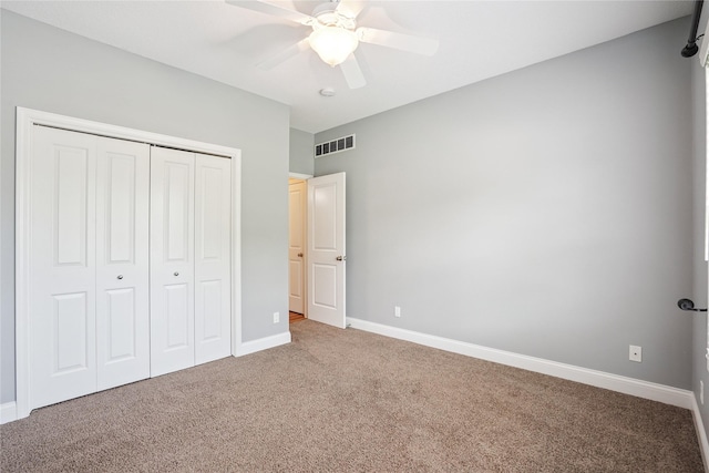 929 Sampson Dr, Nevada, IA 50201 - unfurnished bedroom with carpet floors, a closet, and ceiling fan