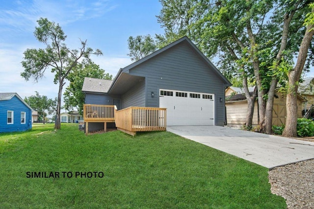 2517 Shaw St, Des Moines, IA 50317 - view of front of home featuring a front yard, concrete driveway, a garage, and a deck