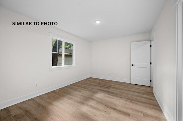 2517 Shaw St, Des Moines, IA 50317 - empty room with light wood-style floors and recessed lighting