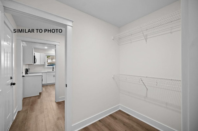2517 Shaw St, Des Moines, IA 50317 - walk in closet with dark wood finished floors