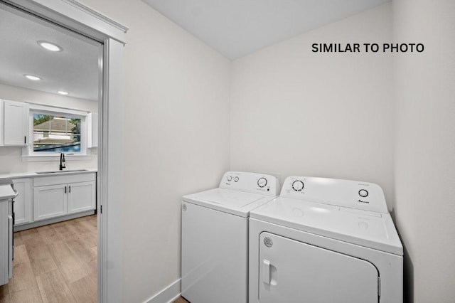 2517 Shaw St, Des Moines, IA 50317 - laundry area with washing machine and clothes dryer, light wood-style flooring, and recessed lighting