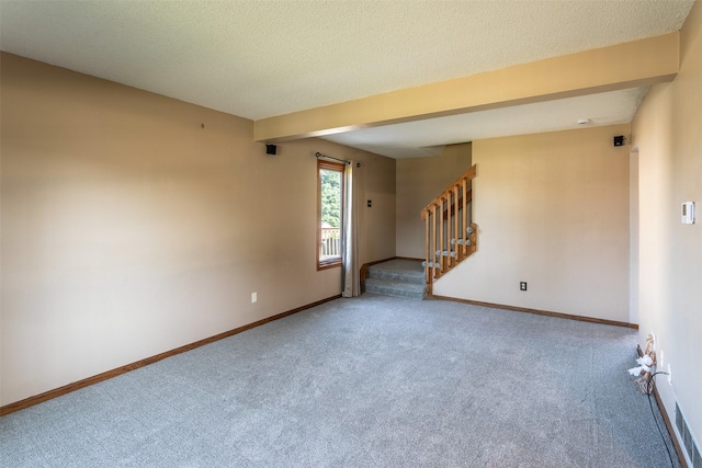 4624 Tamara Ln, West Des Moines, IA 50265 - carpeted empty room with stairway and a textured ceiling