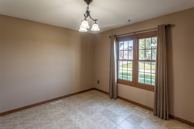 4624 Tamara Ln, West Des Moines, IA 50265 - unfurnished room with baseboards and a textured ceiling