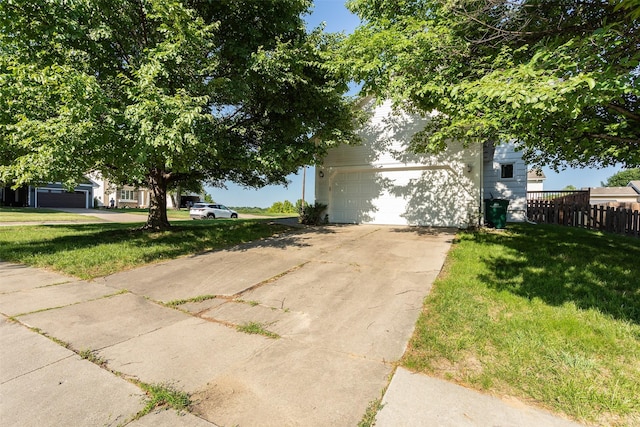 4624 Tamara Ln, West Des Moines, IA 50265 - view of property hidden behind natural elements featuring a garage and driveway