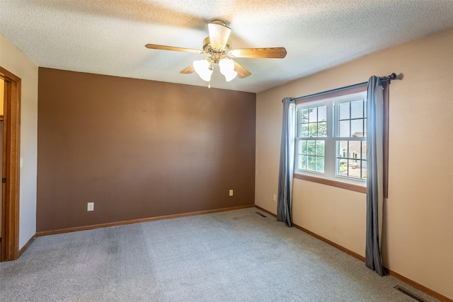 4624 Tamara Ln, West Des Moines, IA 50265 - empty room with carpet floors, ceiling fan, and a textured ceiling