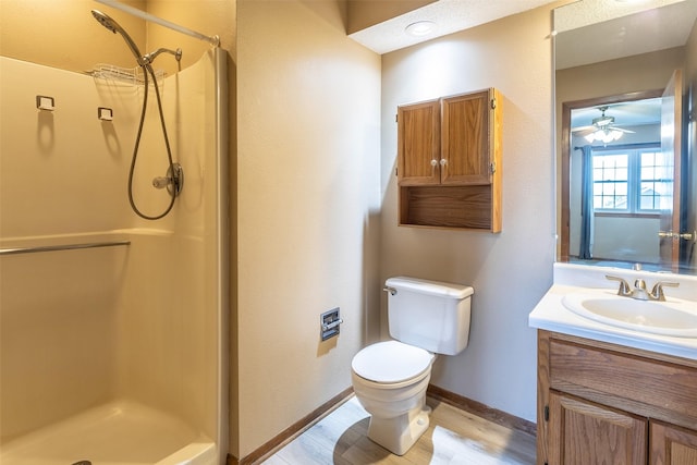 4624 Tamara Ln, West Des Moines, IA 50265 - bathroom featuring vanity, a stall shower, wood finished floors, and ceiling fan