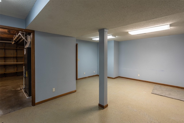 4624 Tamara Ln, West Des Moines, IA 50265 - finished below grade area with a textured ceiling and baseboards