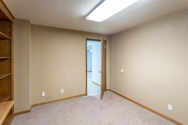 4624 Tamara Ln, West Des Moines, IA 50265 - carpeted empty room with a textured ceiling