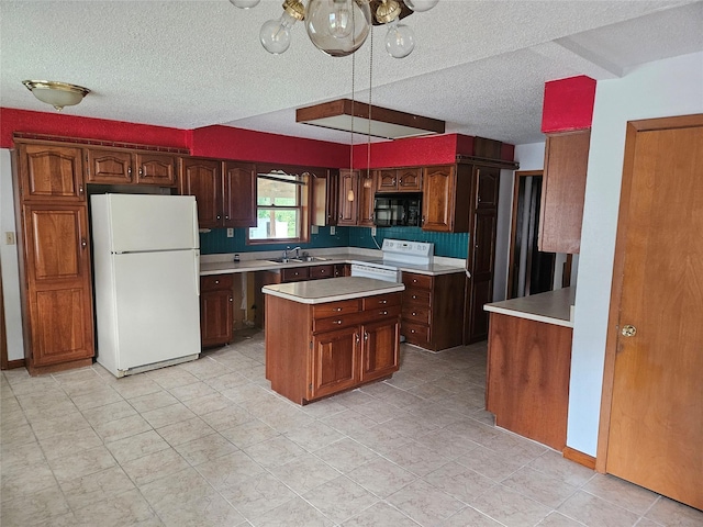4690 Hubbell Ave, Des Moines, IA 50317 - kitchen with white appliances, light countertops, a center island, a textured ceiling, and light tile patterned floors
