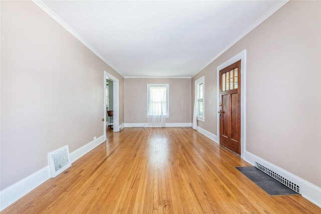 2521 40th St, Des Moines, IA 50310 - entrance foyer with light wood-type flooring and ornamental molding