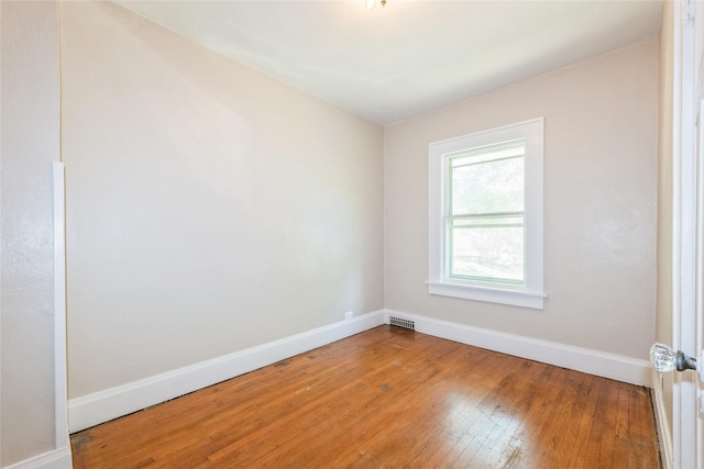 2521 40th St, Des Moines, IA 50310 - empty room featuring wood finished floors and baseboards