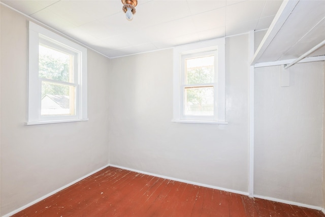2521 40th St, Des Moines, IA 50310 - unfurnished room with wood-type flooring and plenty of natural light