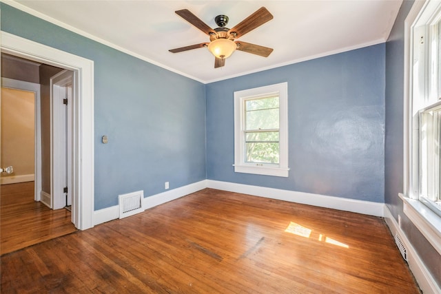 2521 40th St, Des Moines, IA 50310 - spare room with crown molding, wood finished floors, and ceiling fan