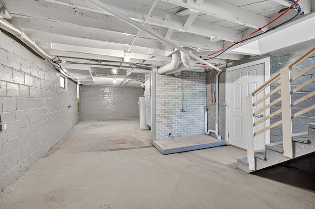 1728 NW Dr, Des Moines, IA 50310 - unfinished below grade area with water heater and stairway