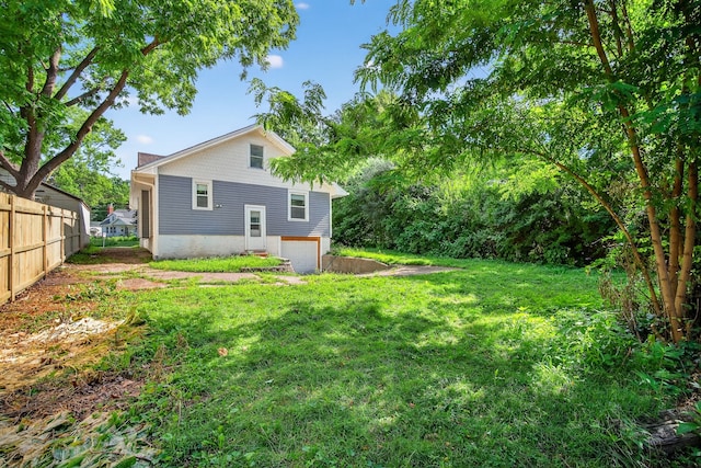 1728 NW Dr, Des Moines, IA 50310 - rear view of house with an attached garage