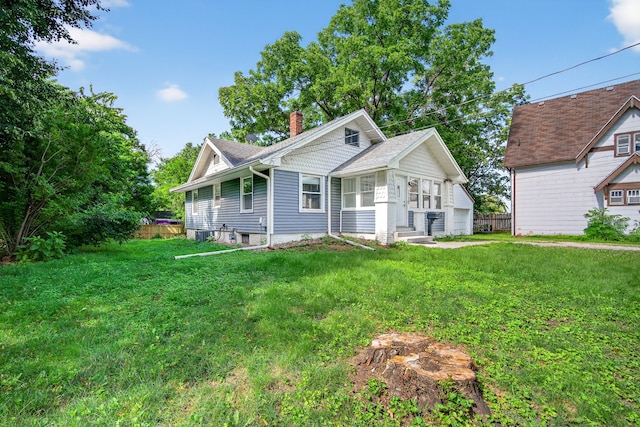 1728 NW Dr, Des Moines, IA 50310 - view of front of house featuring a chimney, a front yard, and roof with shingles