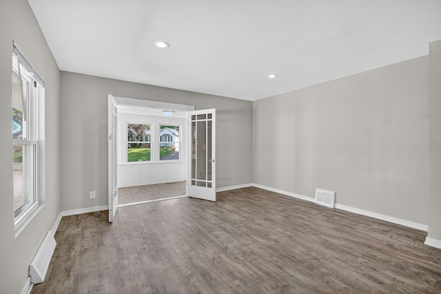 1728 NW Dr, Des Moines, IA 50310 - unfurnished room featuring french doors, wood finished floors, and recessed lighting