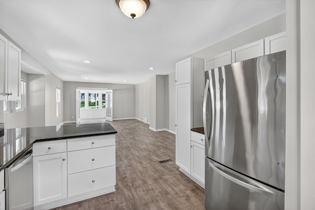 1728 NW Dr, Des Moines, IA 50310 - kitchen featuring appliances with stainless steel finishes, white cabinets, and recessed lighting