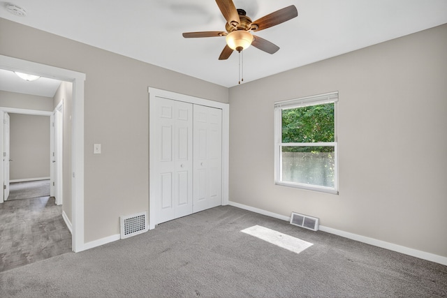 1728 NW Dr, Des Moines, IA 50310 - unfurnished bedroom with carpet flooring, a closet, and a ceiling fan