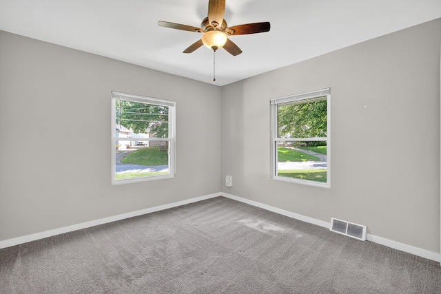 1728 NW Dr, Des Moines, IA 50310 - carpeted spare room featuring plenty of natural light and ceiling fan