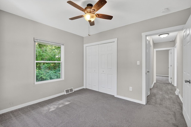 1728 NW Dr, Des Moines, IA 50310 - unfurnished bedroom featuring carpet flooring, a closet, and ceiling fan