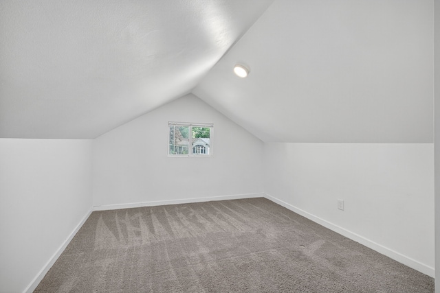 1728 NW Dr, Des Moines, IA 50310 - bonus room featuring carpet floors and vaulted ceiling