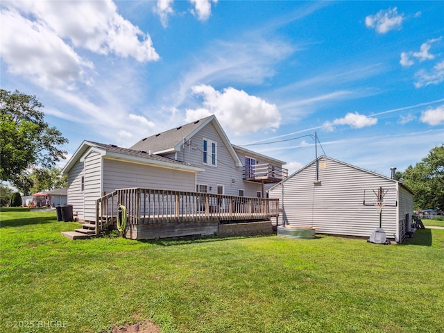 623 N Main St, Stuart, IA 50250 - back of house with a wooden deck and a yard