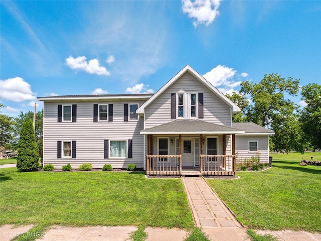 623 N Main St, Stuart, IA 50250 - traditional-style house featuring covered porch and a front lawn