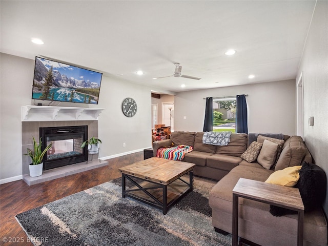 623 N Main St, Stuart, IA 50250 - living area featuring recessed lighting, a ceiling fan, wood finished floors, and a tile fireplace