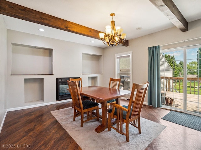 623 N Main St, Stuart, IA 50250 - dining space with beamed ceiling, wood finished floors, a chandelier, a glass covered fireplace, and recessed lighting
