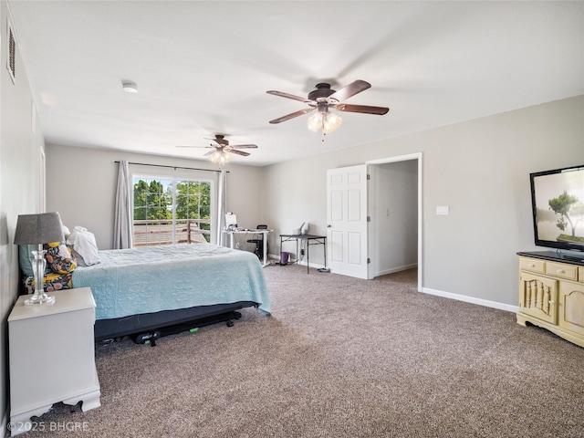 623 N Main St, Stuart, IA 50250 - carpeted bedroom featuring baseboards and a ceiling fan