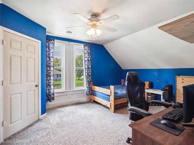 623 N Main St, Stuart, IA 50250 - bedroom with carpet floors, a desk, vaulted ceiling, and ceiling fan