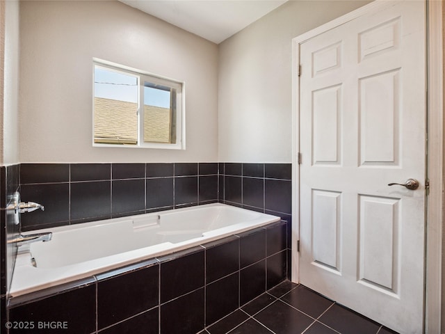 623 N Main St, Stuart, IA 50250 - bathroom with a garden tub and tile patterned floors