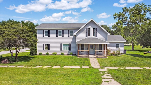 623 N Main St, Stuart, IA 50250 - view of front of property with a porch, a front lawn, and a shingled roof